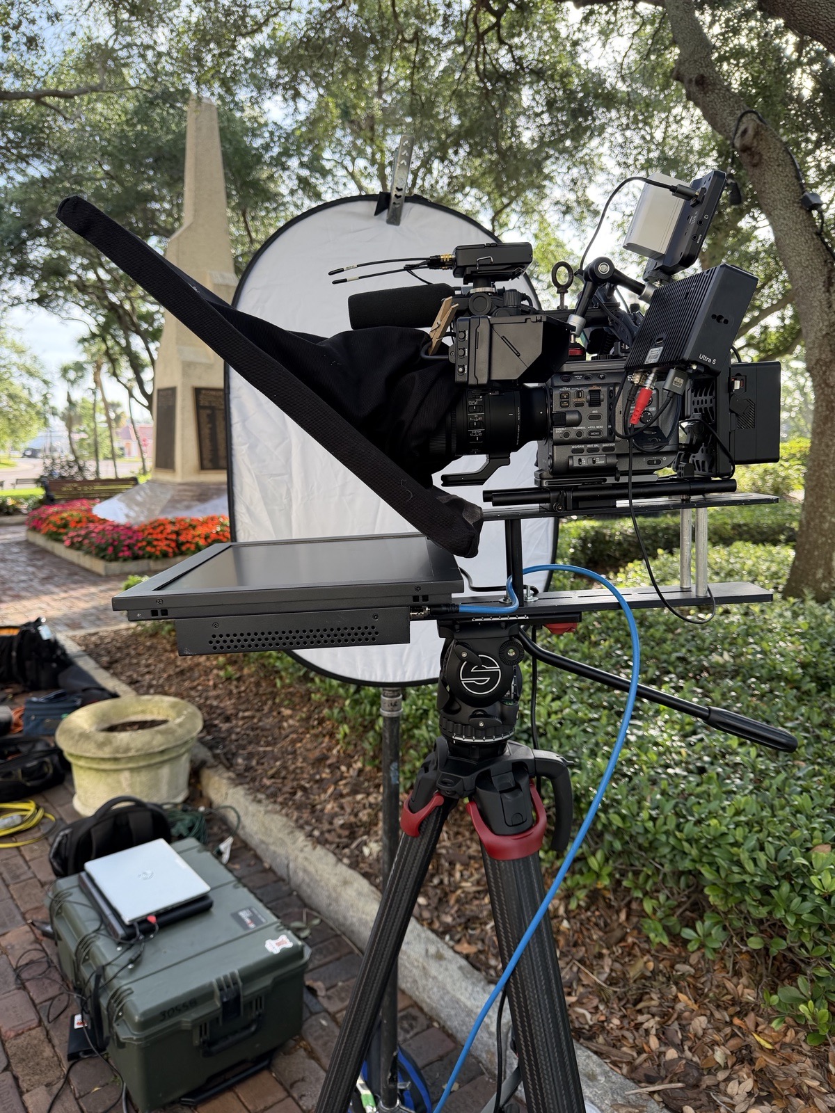 Through-glass teleprompter rig on a cinema camera for an outdoor shoot